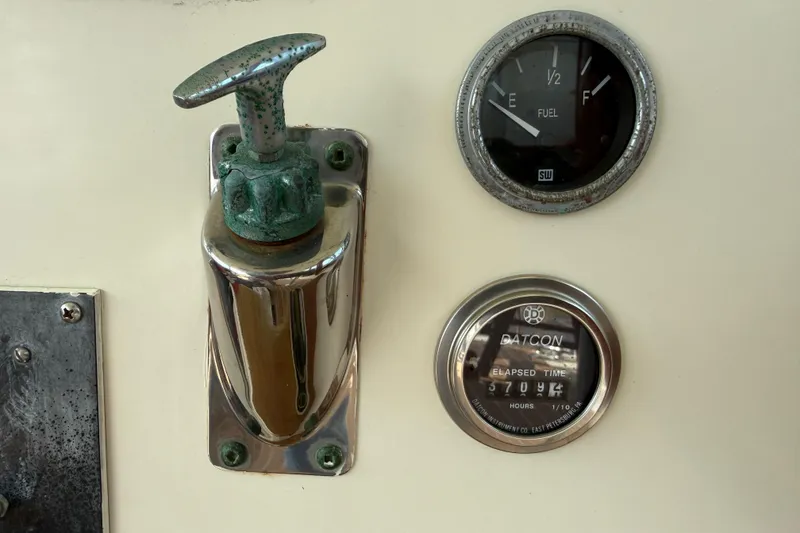 Slide: The Image of Control panel of a 1981 Hatteras 43 Motor Yacht with fuel gauge and elapsed time meter. - 30