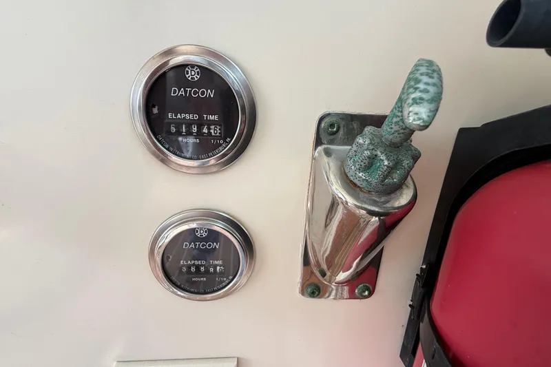 Slide: The Image of Datcon elapsed time gauges on 1981 Hatteras 43 Motor Yacht dashboard. - 31