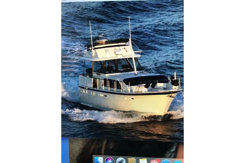 The Image of 1981 Hatteras 43 Motor Yacht cruising on open water. - 0