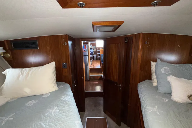 Slide: The Image of Interior cabin of 1981 Hatteras 43 Motor Yacht with twin beds and wood paneling. - 53