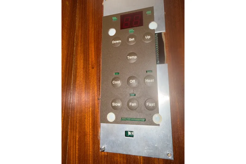 Slide: The Image of Control panel on 1981 Hatteras 43 Motor Yacht, featuring temperature and fan settings. - 58