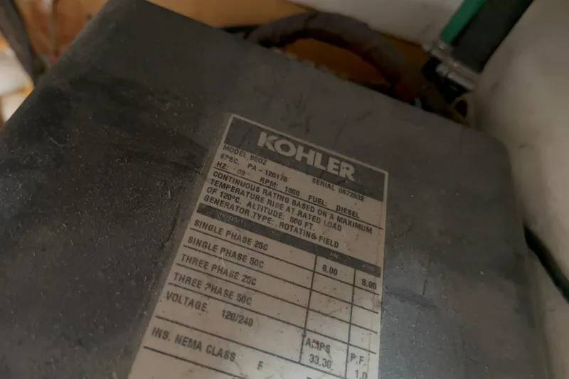 Slide: The Image of Kohler generator label on 1981 Hatteras 43 Motor Yacht, detailing specifications and ratings. - 61