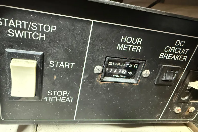 Slide: The Image of Control panel of a 1981 Hatteras 43 Motor Yacht with hour meter and switches. - 62