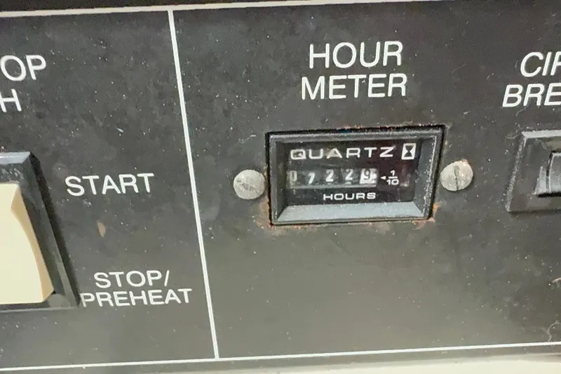 Slide: The Image of Hour meter panel on 1981 Hatteras 43 Motor Yacht, displaying 7229.9 hours. - 63