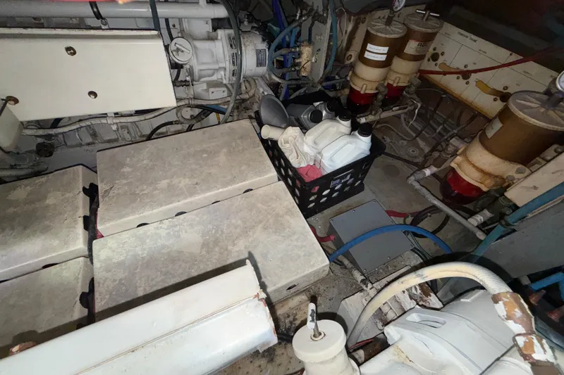 Slide: The Image of Engine room of a 1981 Hatteras 43 Motor Yacht with maintenance supplies. - 78