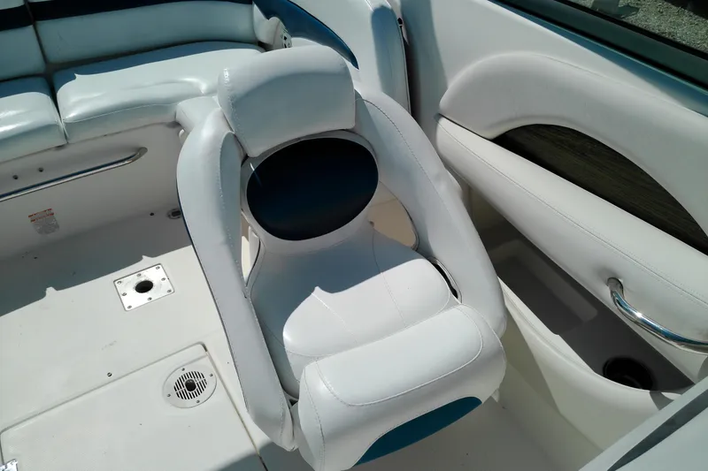 Slide: The Image of 2006 Chaparral 236 SSi boat interior with white seating and sleek design. - 13