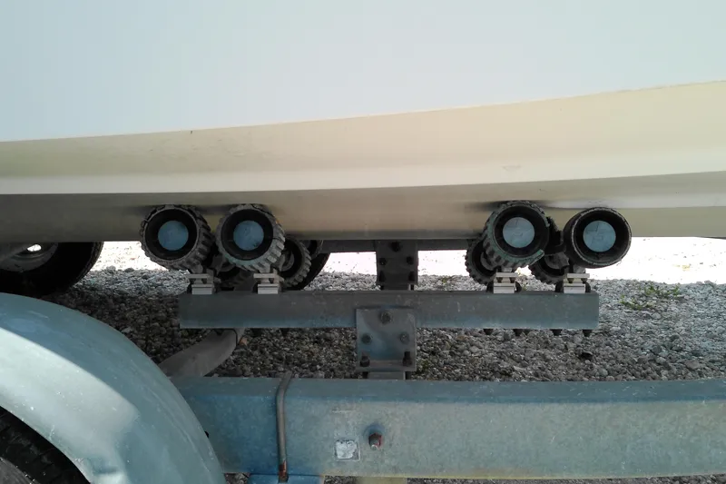 Slide: The Image of Trailer rollers supporting a 2006 Chaparral 236 SSi boat hull. - 3