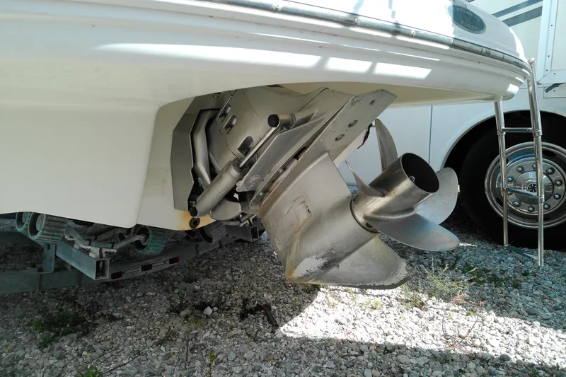Slide: The Image of 2006 Chaparral 236 SSi boat propeller and stern drive on gravel surface. - 5