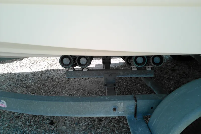 Slide: The Image of Trailer supporting a 2006 Chaparral 236 SSi boat on gravel surface. - 7