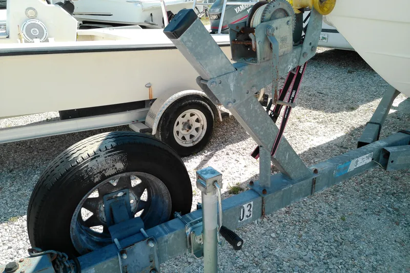 Slide: The Image of Trailer for 2006 Chaparral 236 SSi boat, featuring winch and spare tire. - 8