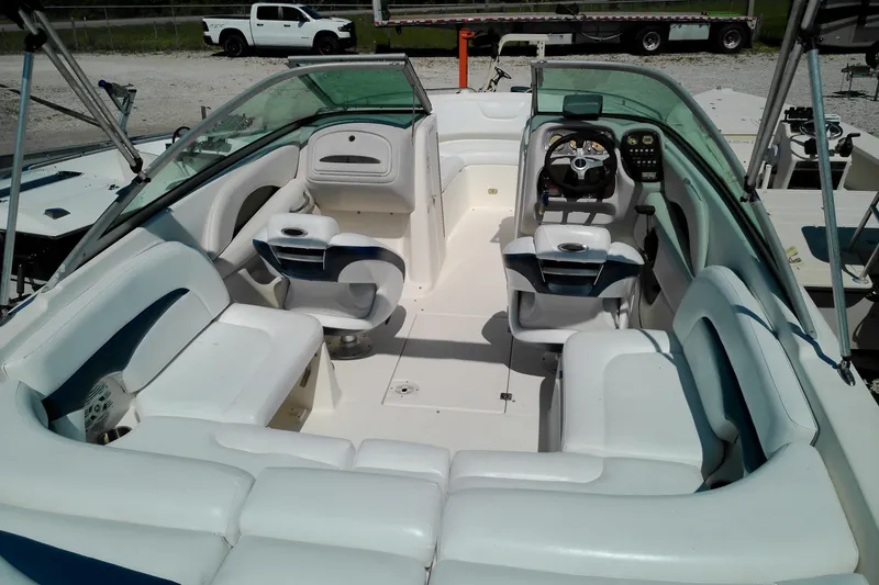 Slide: The Image of 2006 Chaparral 236 SSi boat interior with white seating and steering console. - 9