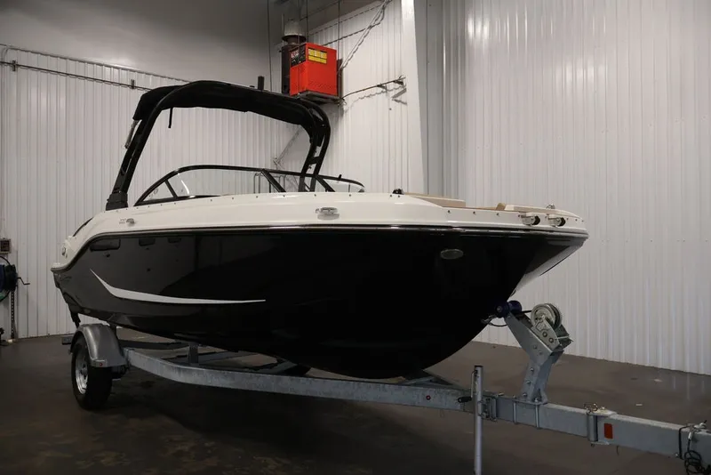 Slide: The Image of 2026 Bayliner D20 boat on trailer in indoor storage facility. - 3