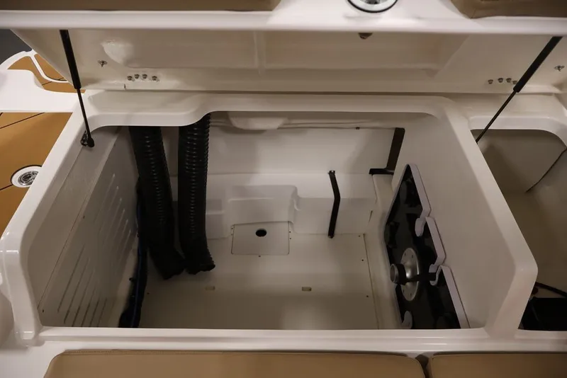 Slide: The Image of Open storage compartment in 2026 Bayliner D20 boat, featuring organized interior space. - 23