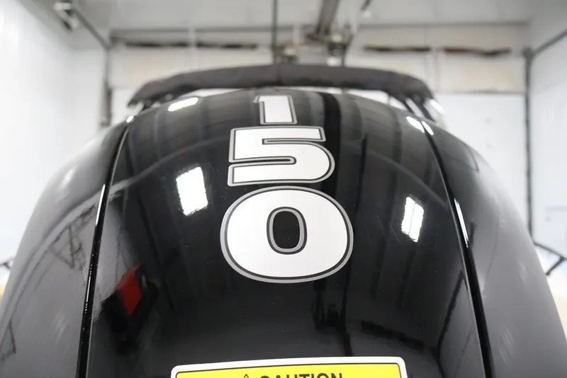 Slide: The Image of Close-up of a 2026 Bayliner D20 boat engine with "150" horsepower label. - 35