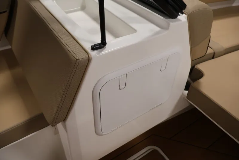 Slide: The Image of 2026 Bayliner D20 boat interior with beige seating and storage compartment. - 39