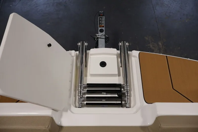 Slide: The Image of 2026 Bayliner D20 boat ladder and storage compartment, top view. - 4