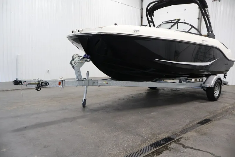 Slide: The Image of 2026 Bayliner D20 boat on trailer in indoor storage facility. - 36