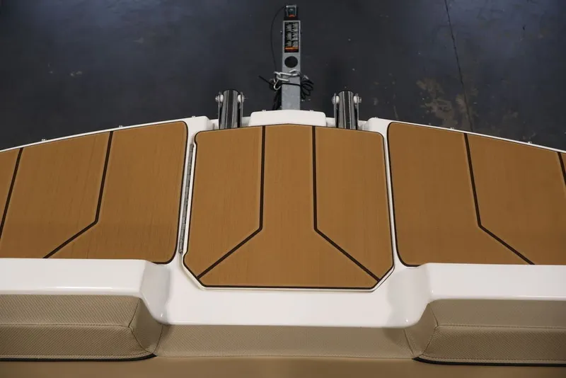 Slide: The Image of 2026 Bayliner D20 boat deck with sleek wooden finish and modern design. - 10