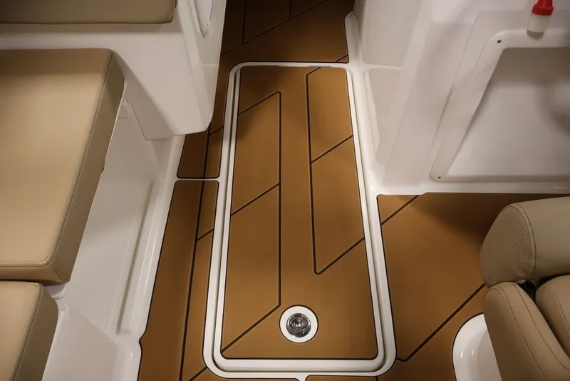Slide: The Image of Interior view of 2026 Bayliner D20 boat with stylish brown flooring and beige seating. - 32