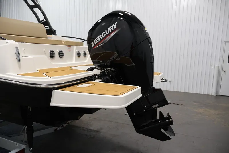 Slide: The Image of 2026 Bayliner D20 boat with Mercury outboard motor in a showroom. - 40