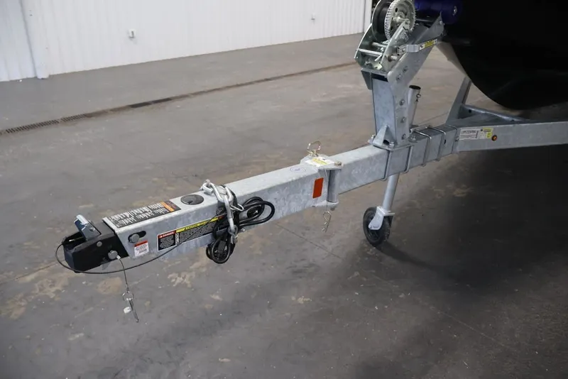 Slide: The Image of Trailer hitch of a 2026 Bayliner D20 boat, featuring a sturdy metal frame. - 42
