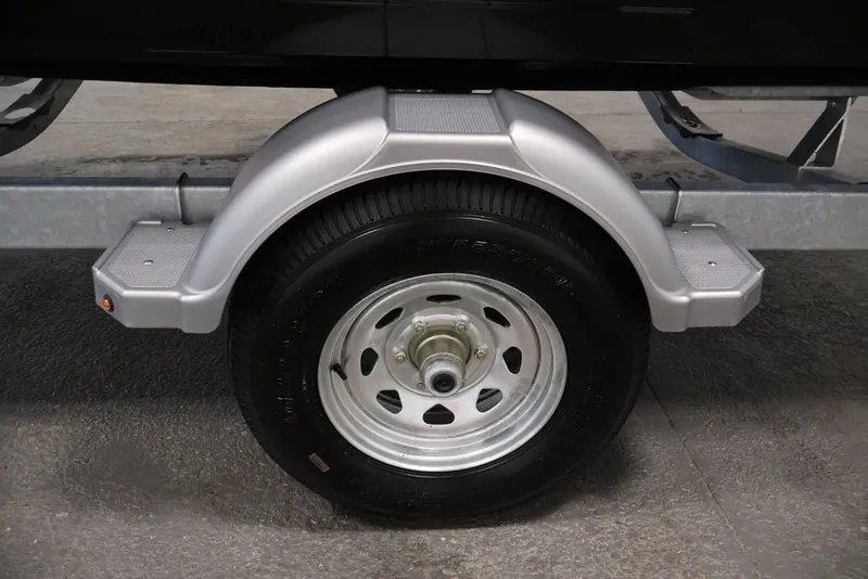 Slide: The Image of Trailer wheel and fender of a 2026 Bayliner D20 boat. - 45