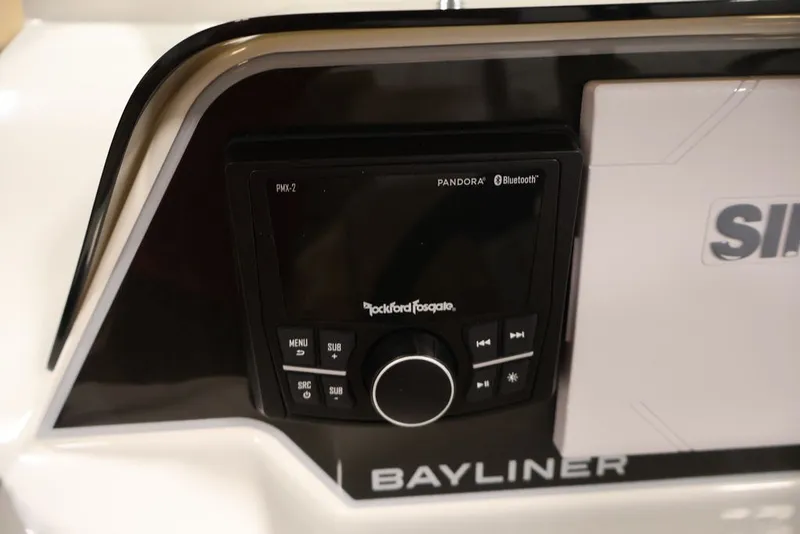 Slide: The Image of 2026 Bayliner D20 boat dashboard featuring Rockford Fosgate audio system with Bluetooth connectivity. - 15