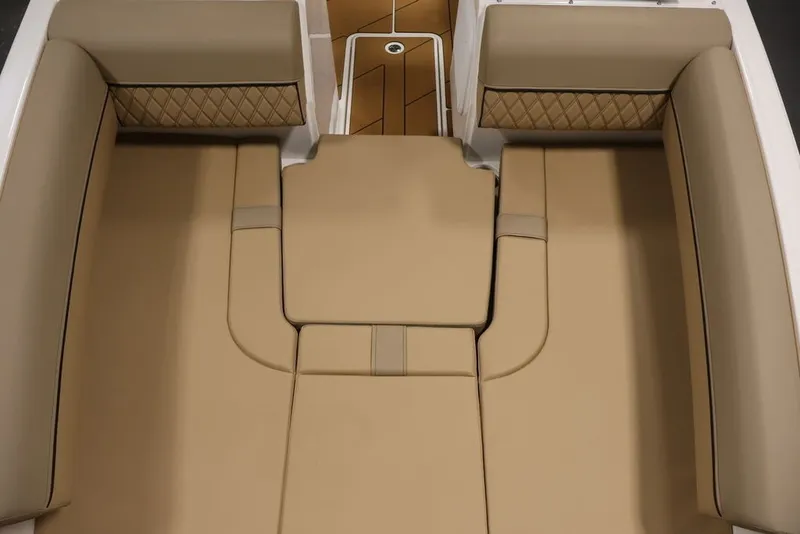Slide: The Image of Luxurious tan seating on 2026 Bayliner D20 boat interior. - 16