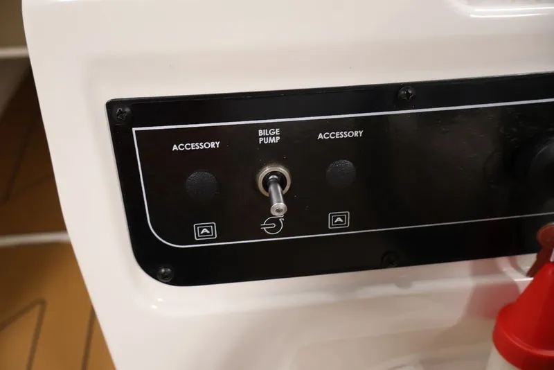 Slide: The Image of Control panel of 2026 Bayliner D20 boat with bilge pump switch. - 34