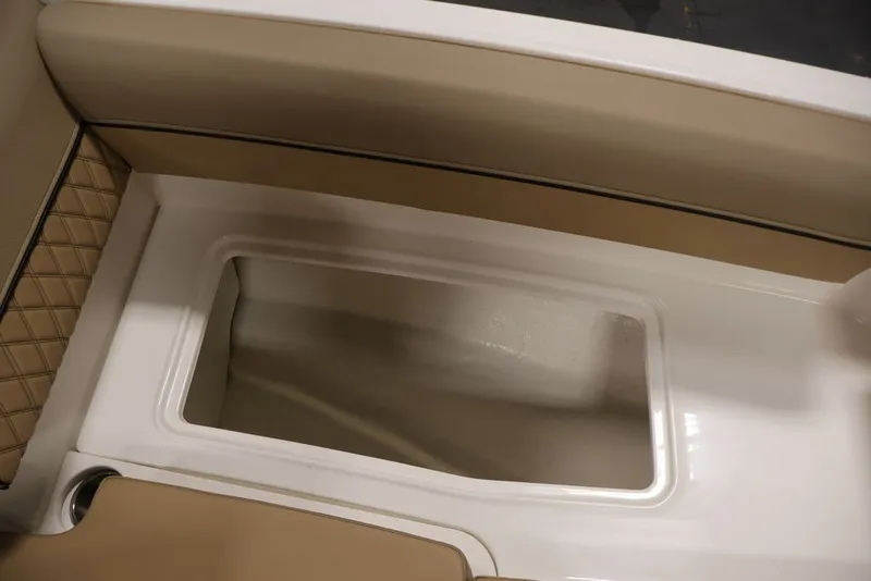 Slide: The Image of Interior storage compartment of 2026 Bayliner D20 boat with beige upholstery. - 44