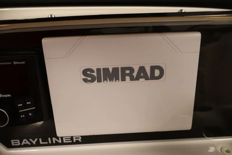 Slide: The Image of 2026 Bayliner D20 dashboard featuring Simrad navigation system. - 20