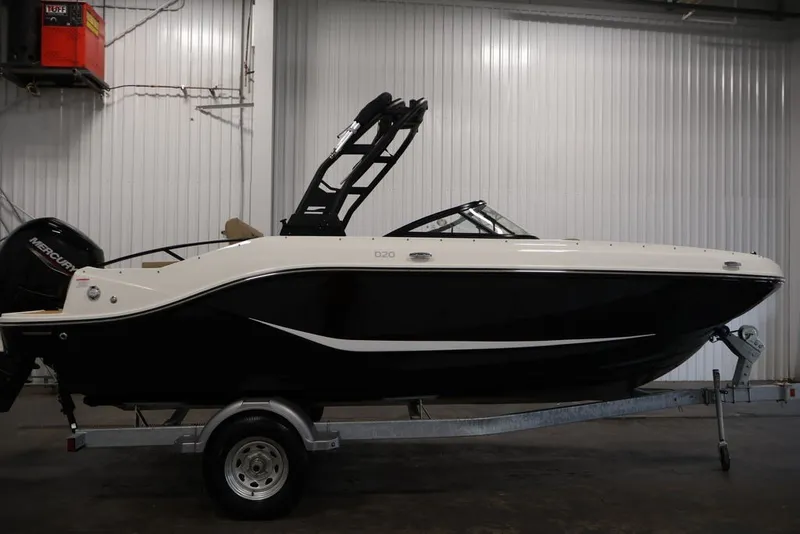 Slide: The Image of 2026 Bayliner D20 boat on trailer in indoor storage facility. - 7