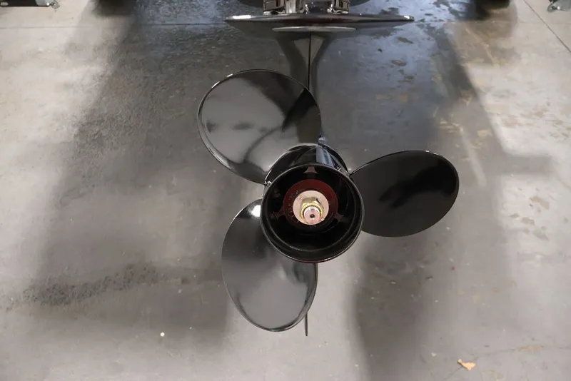 Slide: The Image of 2026 Bayliner D20 boat propeller on a concrete floor, showcasing its sleek design. - 33