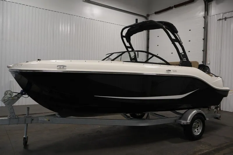 Slide: The Image of 2026 Bayliner D20 boat on trailer in indoor storage facility. - 11