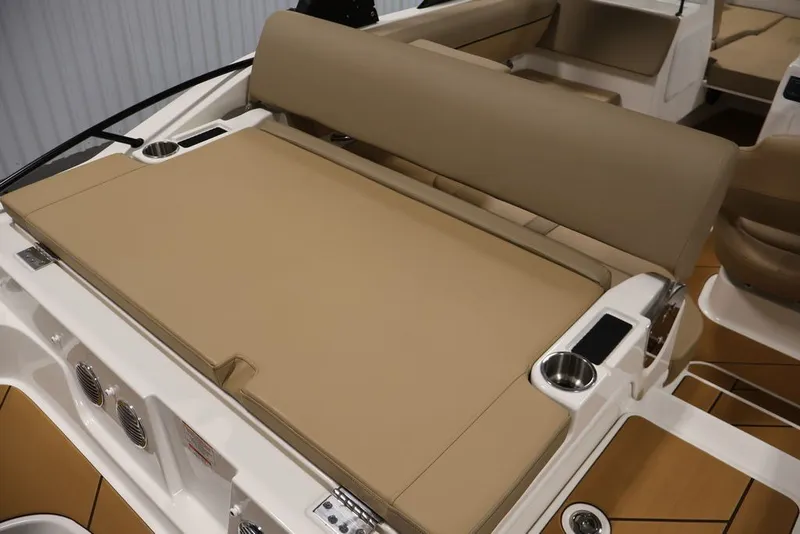 Slide: The Image of 2026 Bayliner D20 boat interior with beige seating and cup holders. - 19