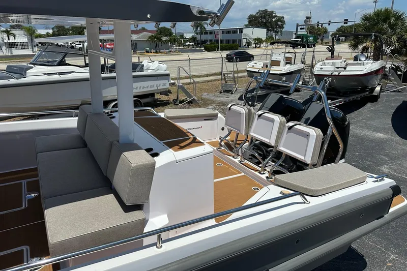 Slide: The Image of 2024 Axopar 37 Sun-Top boat with spacious seating and modern design. - 15