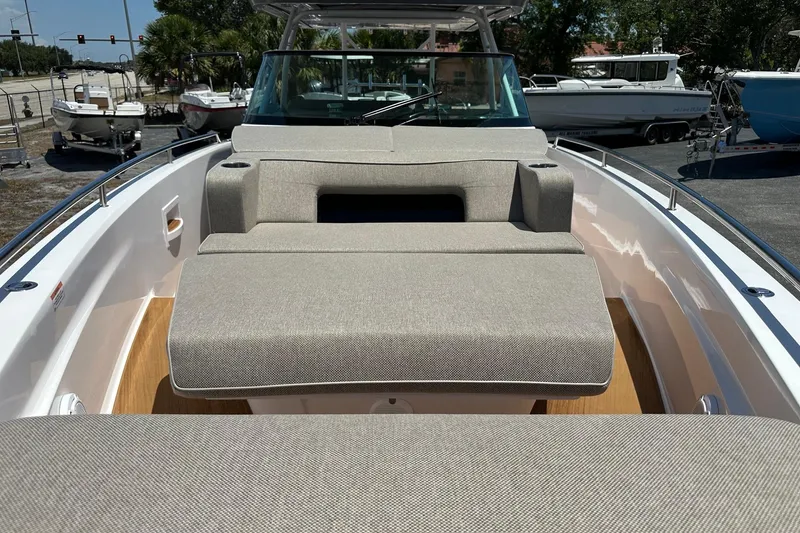 Slide: The Image of 2024 Axopar 37 Sun-Top boat with spacious sunbed and sleek design. - 17