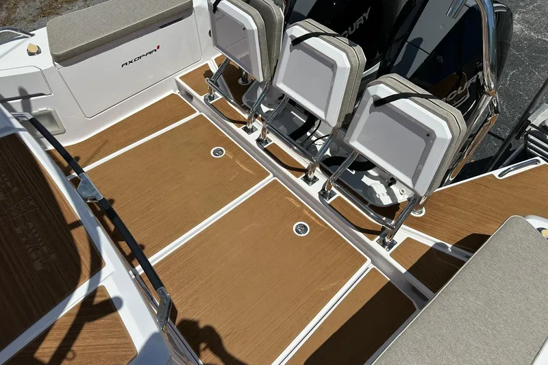 Slide: The Image of 2024 Axopar 37 Sun-Top boat deck with seating and Mercury engines. - 40