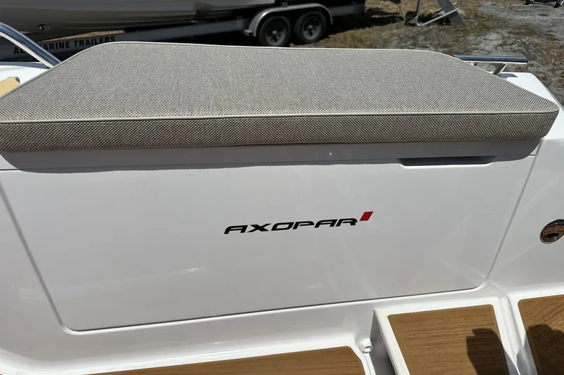 Slide: The Image of 2024 Axopar 37 Sun-Top boat seat with logo, featuring sleek design and comfortable cushion. - 45