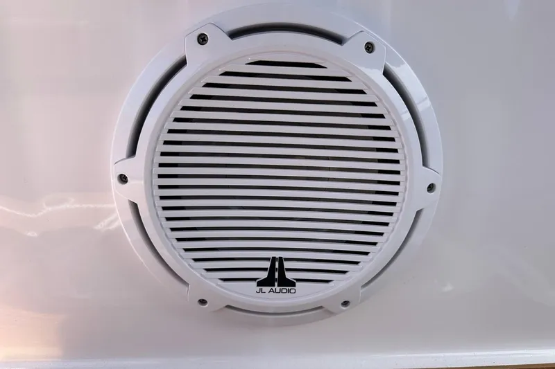Slide: The Image of JL Audio speaker on 2024 Axopar 37 Sun-Top boat, white grille design. - 62