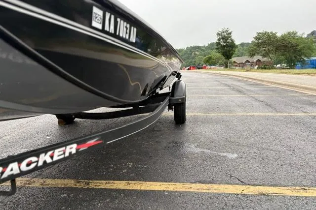 Slide: The Image of 2023 Tracker Pro 170 boat on trailer in parking lot, overcast day. - 13