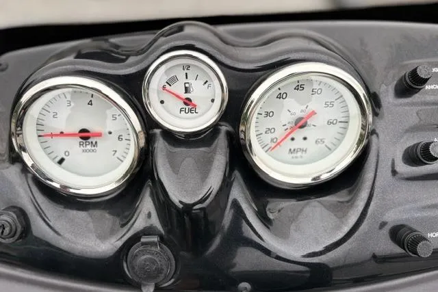 Slide: The Image of Dashboard of 2023 Tracker Pro 170 boat showing RPM, fuel, and speed gauges. - 17