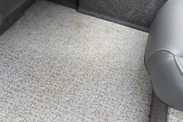 Slide: The Image of Carpeted interior of 2023 Tracker Pro 170 boat, featuring gray upholstery. - 25