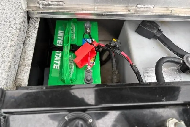 Slide: The Image of Battery compartment of a 2023 Tracker Pro 170 boat with Interstate battery. - 28
