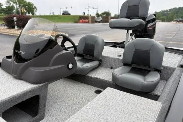Slide: The Image of 2023 Tracker Pro 170 boat interior with seating and steering console. - 31