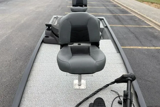 Slide: The Image of 2023 Tracker Pro 170 boat with gray seating and trolling motor on a trailer. - 35