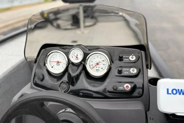Slide: The Image of Dashboard of 2023 Tracker Pro 170 boat with gauges and controls. - 38
