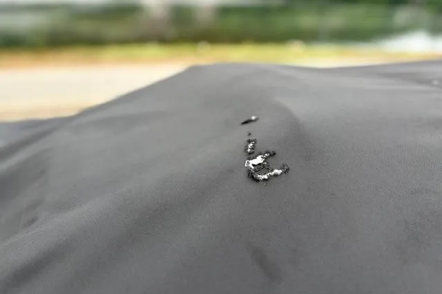 Slide: The Image of Close-up of a black fabric surface with small tears, possibly on a 2023 Tracker Pro 170. - 41
