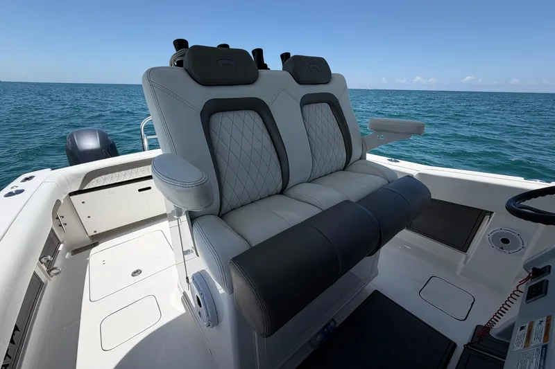 Slide: The Image of 2023 World Cat 280 CC-X boat interior with luxurious seating on open water. - 5