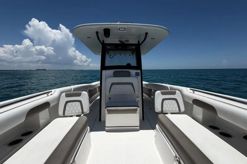 Slide: The Image of 2023 World Cat 280 CC-X boat interior with ocean view, featuring sleek seating and modern design. - 4